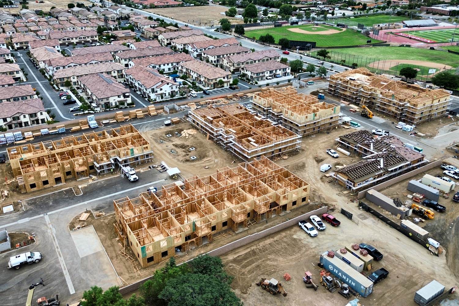 Aerial of community-scale multifamily wood framing mid-progress