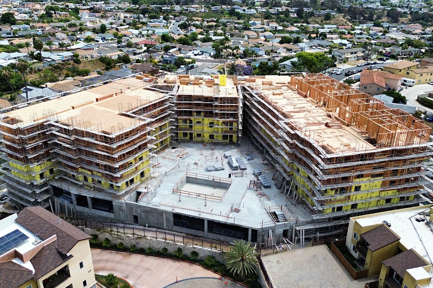 Aerial of U-shaped podium mid-rise wood framing