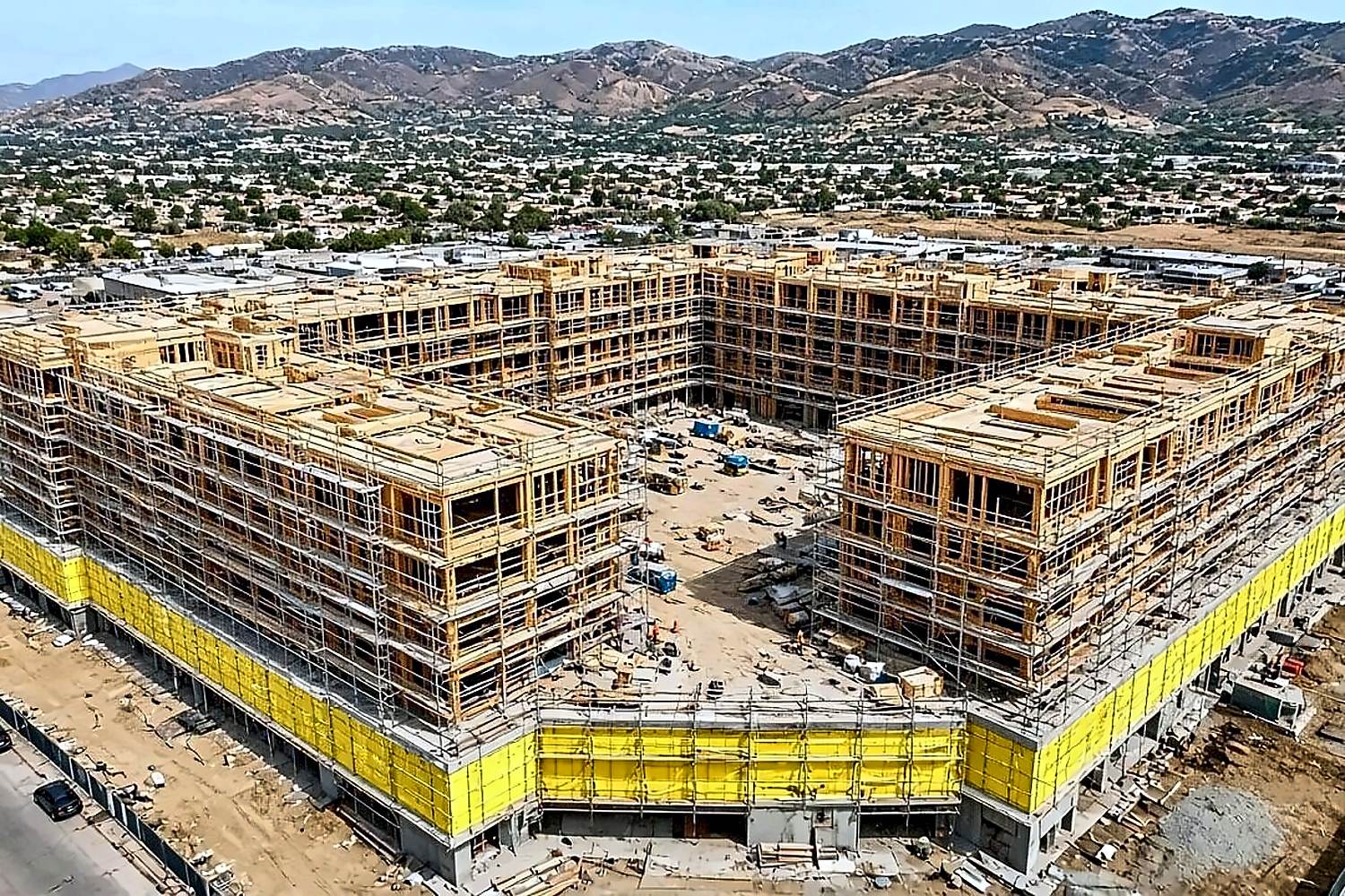 Aerial of large courtyard podium multifamily framing